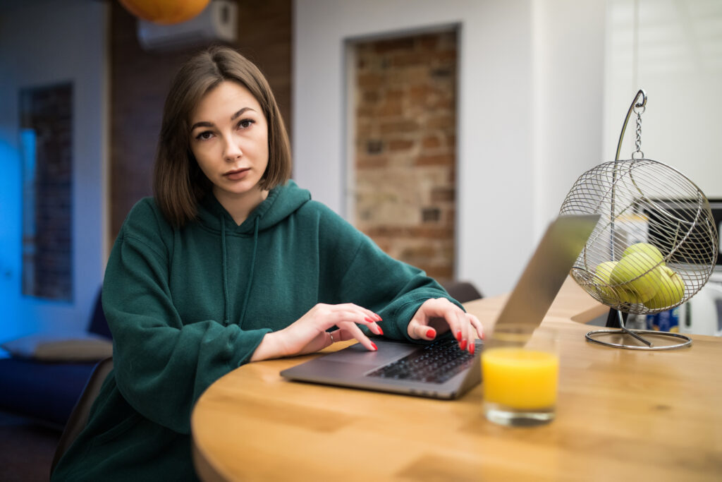 surprised-brunette-woman-is-working-her-laptop-kitchen-table-drinking-orange-juice-1024x683 Top 5 Online Freelance Side Hustles That Actually Pay